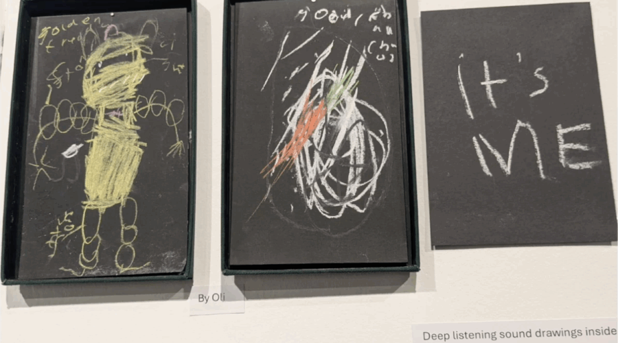 A row of three images drawn with chalk on black paper including a person apparently wrapped in bandages and the words "It's me"